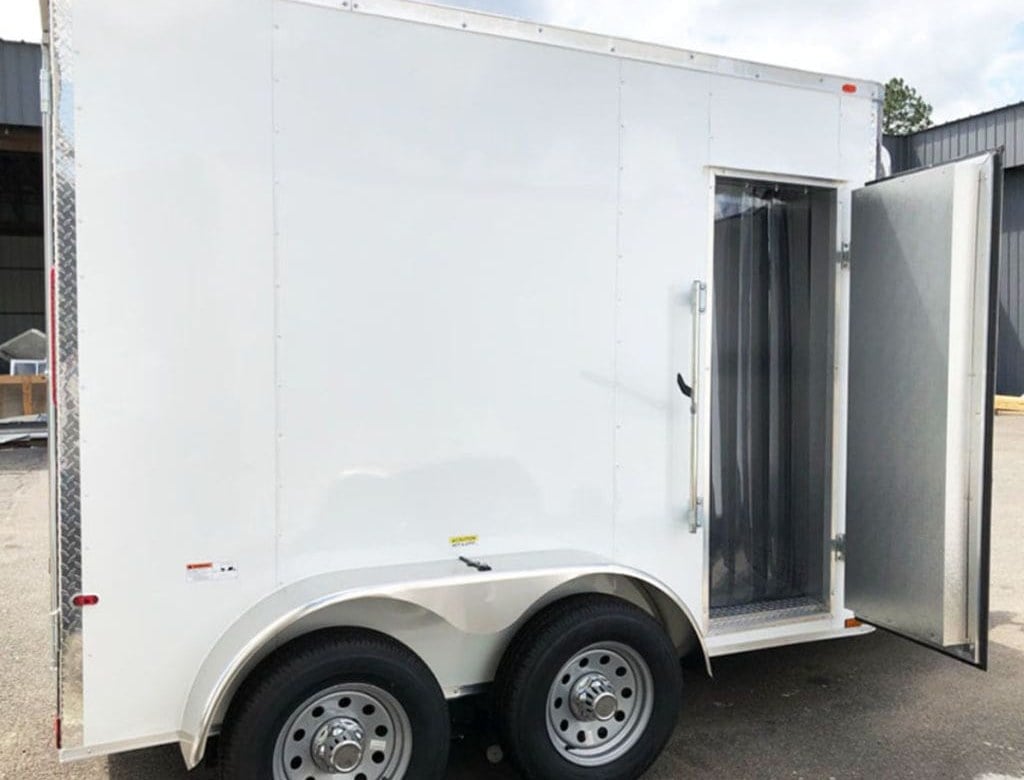 SDG-801 5x10 refrigerated trailer in white with the insulated side door open, showing the strip curtain and cold-box interior
